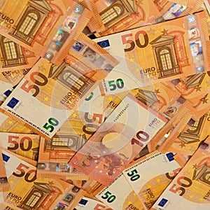 Texture of 50 euros, many identical bills that lie together