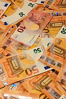 Texture of 50 euros, many identical bills that lie together.