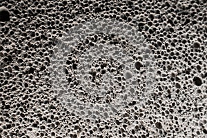 The texture of aerated concrete close-up. Abstract background of aerated concrete bricks. The structure of the gas block,