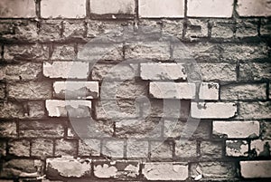 Texture of aged brick wall with cracked weathered structure white gray color close-up