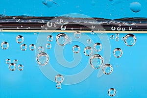 Texture of air bubbles in water on blue backroud