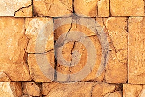 Ancient wall texture of cracked stone blocks