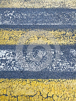 Texture, asphalt background with marked pedestrian crossing