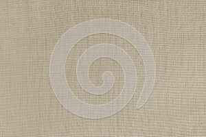 Texture background of beige linen fabric, cloth surface, weaving of natural cotton fabric