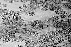 Texture, background,   black steel gray fabric with a paisley pattern.based on traditional Asian elements