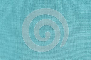 Texture background of cyan linen fabric, cloth surface, weaving of natural cotton fabric