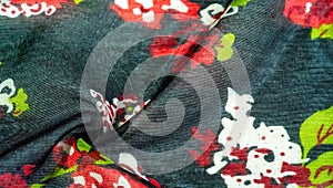 Texture background, dark blue silk fabric with roses painted colors, colors are blue red white green