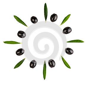 Texture background with green and black olives and with olive leaves. Isolated on white background.