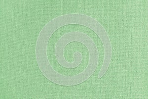 Texture background of green cotton fabric, cloth surface, weaving of linen fabric