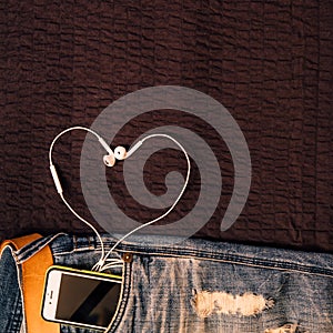 Texture background of jeans , belt detail with mobilephone and e