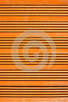 Texture and background of old wooden paneling painted orange