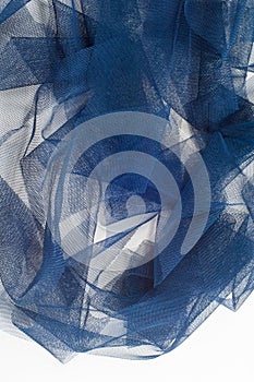 Texture, background, pattern. Blue ribbon in a small grid. Wide