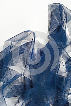 Texture, background, pattern. Blue ribbon in a small grid. Wide