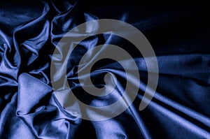 Texture, background, pattern. Dark blue silk fabric. Designer So