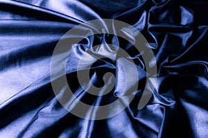 Texture, background, pattern. Dark blue silk fabric. Designer So