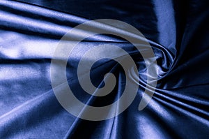 Texture, background, pattern. Dark blue silk fabric. Designer So