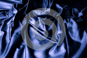 Texture, background, pattern. Dark blue silk fabric. Designer So