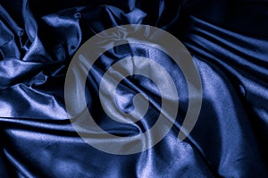 Texture, background, pattern. Dark blue silk fabric. Designer So