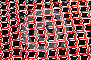 Texture, background, pattern. Fabric drawing of a diamond diamond red on a black background