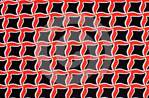 Texture, background, pattern. Fabric drawing of a diamond diamond red on a black background