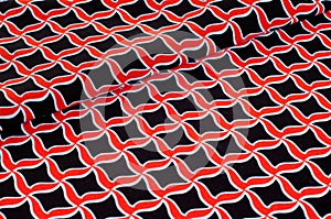 Texture, background, pattern. Fabric drawing of a diamond diamond red on a black background
