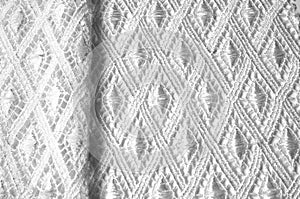 Texture background pattern. Lacy white fabric. Handmade lace on