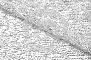 Texture background pattern. Lacy white fabric. Handmade lace on