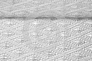 Texture background pattern. Lacy white fabric. Handmade lace on