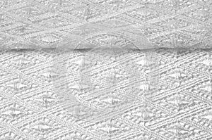 Texture background pattern. Lacy white fabric. Handmade lace on
