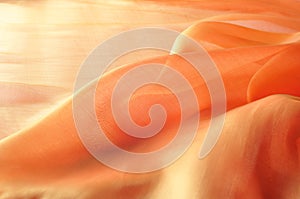 Texture, background, pattern. Orange Silk Fabric for Drapery Abs