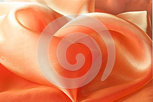 Texture, background, pattern. Orange Silk Fabric for Drapery Abs