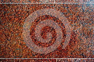 Texture, background, pattern. Photo of red granite. Facing granite slabs. Plane polished granite plate closeup as background.