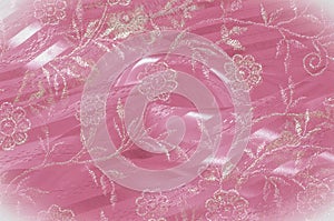 Texture, background, pattern. Pink lace decorated with flowers o