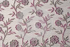 Texture, background, pattern. Pink lace decorated with flowers o