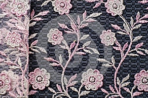 Texture, background, pattern. Pink lace decorated with flowers o