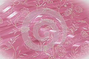 Texture, background, pattern. Pink lace decorated with flowers o