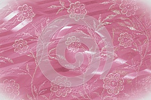 Texture, background, pattern. Pink lace decorated with flowers o