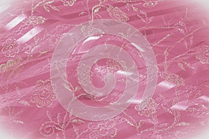 Texture, background, pattern. Pink lace decorated with flowers o