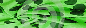 Texture, background, pattern, postcard, silk fabric, green print from the fabric of black hearts, your projects will not go