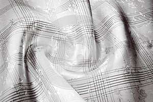 Texture background pattern. Silk fabric black and white.abstract black background luxury fabric or liquid wave or wavy folds of g