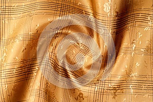 Texture background pattern. Silk fabric is brown, chocolate with
