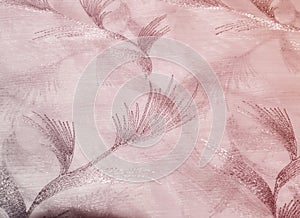 Texture, background, pattern. Tulle of pastel pink tones. Abstract background of pink fabric. Soft texture of the fabric, pink pa