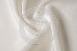 Texture background pattern. White silk fabric. Closeup of a rippled white silk fabric. Advertising space. Smooth elegant white si