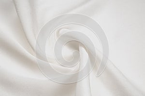 Texture background pattern. White silk fabric. Closeup of a rippled white silk fabric. Advertising space. Smooth elegant white si