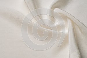 Texture background pattern. White silk fabric. Closeup of a rippled white silk fabric. Advertising space. Smooth elegant white si