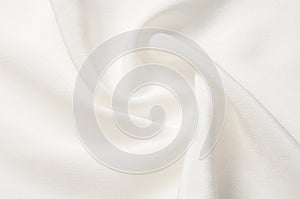 Texture background pattern. White silk fabric. Closeup of a rippled white silk fabric. Advertising space. Smooth elegant white si