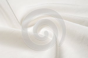 Texture background pattern. White silk fabric. Closeup of a rippled white silk fabric. Advertising space. Smooth elegant white si