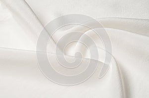 Texture background pattern. White silk fabric. Closeup of a rippled white silk fabric. Advertising space. Smooth elegant white si