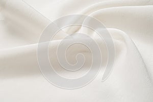 Texture background pattern. White silk fabric. Closeup of a rippled white silk fabric. Advertising space. Smooth elegant white si