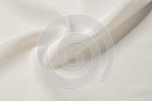 Texture background pattern. White silk fabric. Closeup of a rippled white silk fabric. Advertising space. Smooth elegant white si